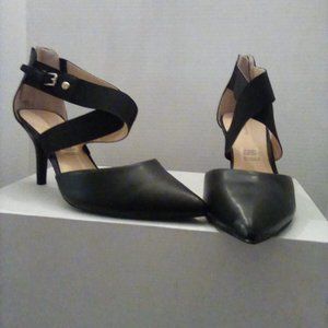 Matte black with gold accents Liz Claiborne strap top zip heel pumps. Never worn